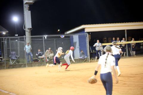 Ky Dubose (11) tags a runner out. (Photo by Bo Underwood)