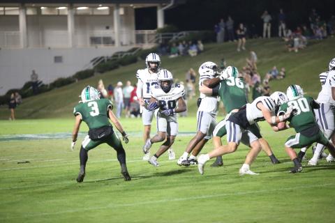 Tyler Turman carries the ball in Elbert’s 48-14 loss to Athens Academy on Oct. 17. (Photo by Bo Underwood)