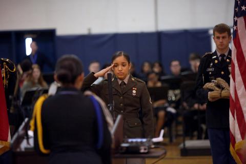 ECCHS JROTC cadet Isabel Cruz salutes during the ECCHS Veteran's Day program Nov. 11. (Photo by Bo Underwood)