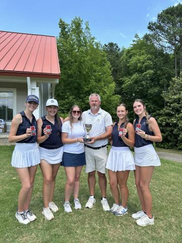 Girls golf coach Larry Kesler (third from right) celebrates with his girls team after finishing second in the state in the GHSA Class A Division 1 State Championship match at Arrowhead Pointe in May. (Photo courtesy of Elbert County Golf)
