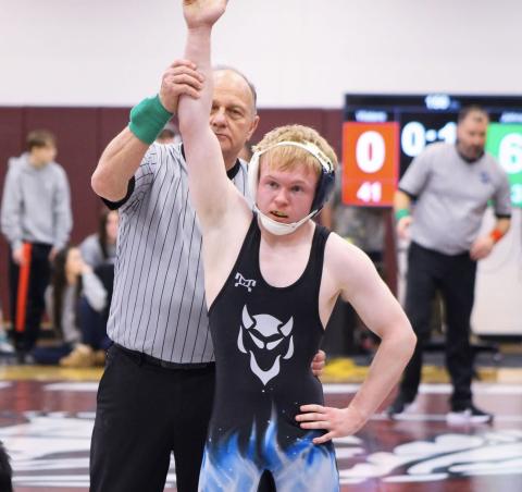 Cooper West is declared the winner by the official. (Photo courtesy of April Dixon Hughes)