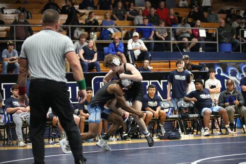 Jayden Thompson shoots for a doubleleg takedown in a match against Olgethorpe County. (File photo by Mark Wells)