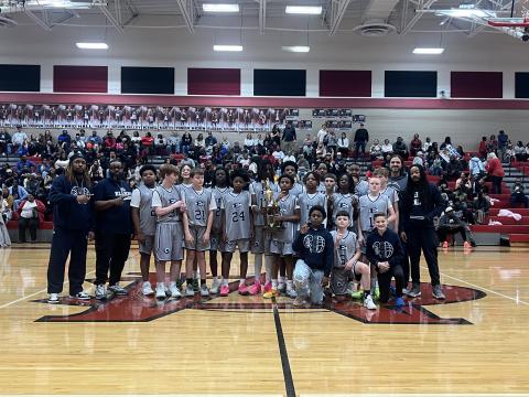 The Elbert County Middle School seventh grade boys’ basketball team poses after their win in the NEGIAA championship game. (Photo Courtesy of Derek Aston)