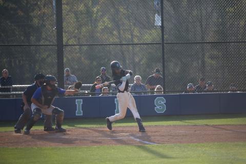 Cheyvis McLendon hits the ball. (Photo by Bo Underwood)