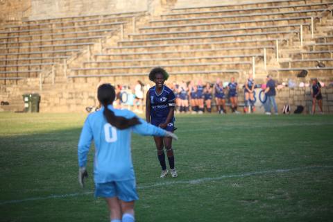  County senior Promouz Goodman celebrates after making the game-winning penalty kick. (Photo by Bo Underwood)