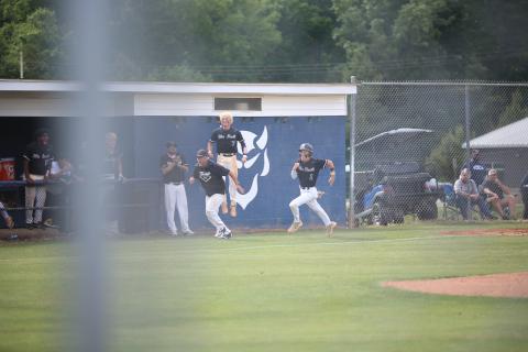 Elbert County head coach Lance Ingram (left) runs alongside shortstop Brayden Ingram (1) after sending him home as Jackson Black (7) celebrates. (Photo by Bo Underwood)