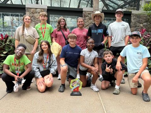 The Elbert County Middle School Beta Club won two awards at the national convention in Nashville, Tennesee last week. Above, the club poses with their 10th-place Project Proposal trophy. Club members include (front row, L-R) Alyssa Handy, Sophie Black, Landon Hulme, Myla Hood, Michael Evans, Klay Hall and (back row, L-R) Claire Moon, Monroe Ray, Lizzy Sigman, Reece Oakley, Levi Wiles and Kale Hall. (Photo courtesy of Marie Roach)