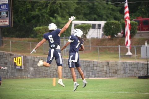 Zaylen Moon (7) celebrates his touchdown with Jackson Black (5). (Photo by Bo Underwood)
