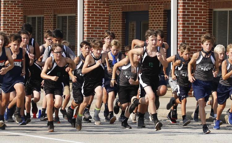 Rams runners (L-R) Mason Dove, Aiden Belli, Kale Kurtz, Brayden Ingram, Eli Harris, Sam Gailey, Madden Drake take off from the starting line in the first Elbert County Middle School Cross County meet Sept. 10. (Photo by Cary Best)
