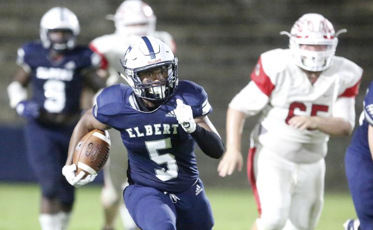 Blue Devil junior running back C.J. Tate rushes for an 80-yard touchdown during Elbert County’s 56-7 region win over Social Circle Friday night Sept. 27 in the Granite Bowl in Elberton (Photo by Cary Best).