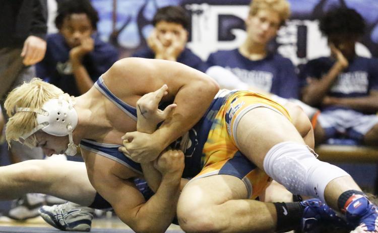 Mat Devil senior Brice Noggle pins Apalachee senior Brandon Bryant as his teammates (L-R) Trez White, Camden Harris, Nolan Johnson and Tyshawn Hughes look on during the Granite City Scramble Nov. 23 in the Inferno. (Photo by Cary Best)