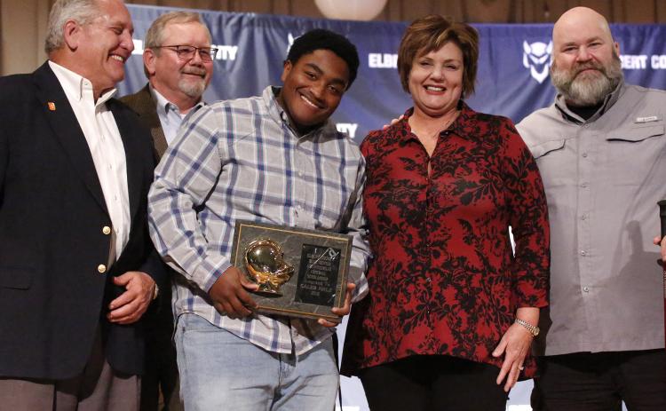 Blue Devil senior Caleb Hale (center) reacts as he accepts the 2019 L.C. Piccirillo Scholarship and Football Award during the Elbert County Athletic Department’s Fall Sports Awards Program Monday night Dec. 9 in the Elbert County Middle School Auditorium. Pictured with Hale (L-R) are Ciro Piccirillo, Ed Fendley, Nannette Piccirillo and Lenny Piccirillo. (Photo by Cary Best)
