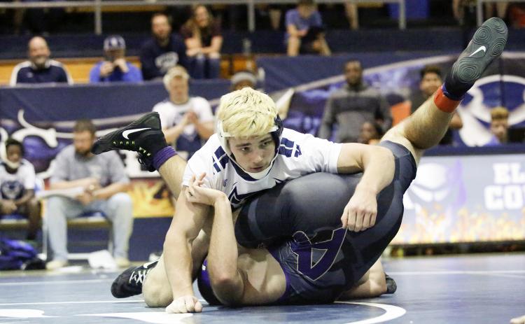 Mat Devil senior Gavin Brady (top) breaks the Elbert County High School career wins record by pinning Athens Christian’s 182-pound wrestler Joseph Ulrich Dec. 10 in the Inferno in Elberton. (Photo by Cary Best)