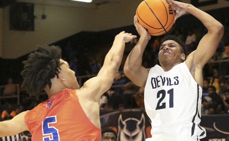 Blue Devil freshman guard Trustin Allen shoots over Jaguar Isaiah Sanchez in Elbert County’s 65-40 loss to Cedar Shoals Dec. 20 in the Inferno. (Photo by Dan Giles)