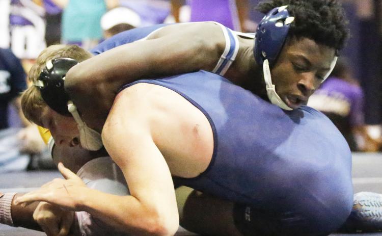 Mat Devil junior Jamal Rucker picked up his 100th career win Nov. 27 at St. Pius High School. (File photo by Cary Best)