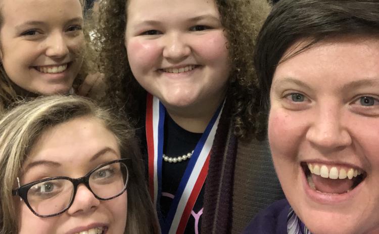 Shown are (L-R) Abigail Rushing, Lana Sherman and Emma Williams along with ECMS, ECCHS Choral Director Allyson Dye.