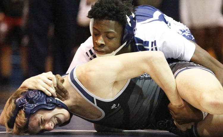 Mat Devil junior Jamal Rucker (top) defeated East Jackson’s Ryan Sparks by pin in the second round of 126-pound division of the Inferno Invitational Jan. 25 in Elberton. (Photo by Cary Best)