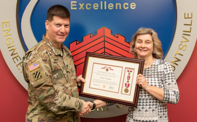 Vicky Stanley was presented the Meritorious Civilian Service Award by Col. Marvin Griffin, Commander, U.S. Army Engineering and Support Center on Jan. 13 in Huntsville, Alabama.