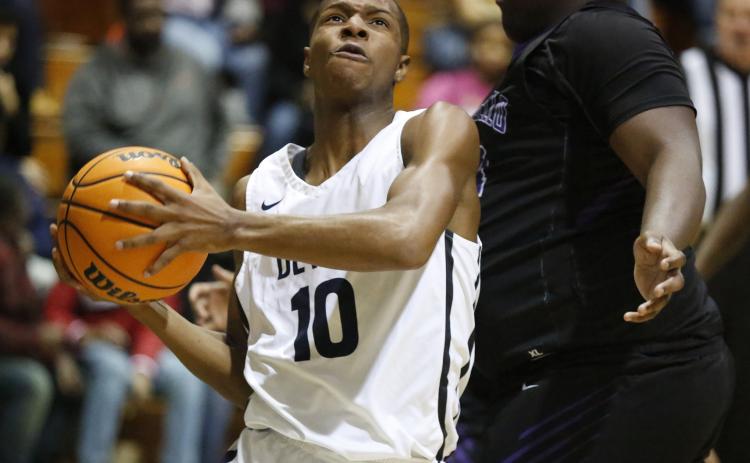 Sophomore shooting guard Jamil Burton led the Blue Devils in scoring with 21 points in Elbert County’s 71-64 first-round region tournament win over Monticello Feb. 3 at Banks County in Homer. (Photo by Cary Best)