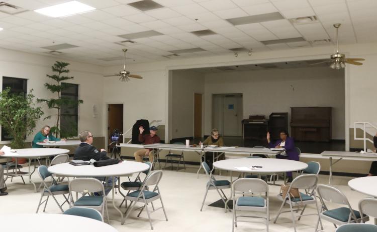 The Bowman council practiced 'social distancing' at its meeting at the Bowman Community Center Monday night. (Photo by Scoggins)