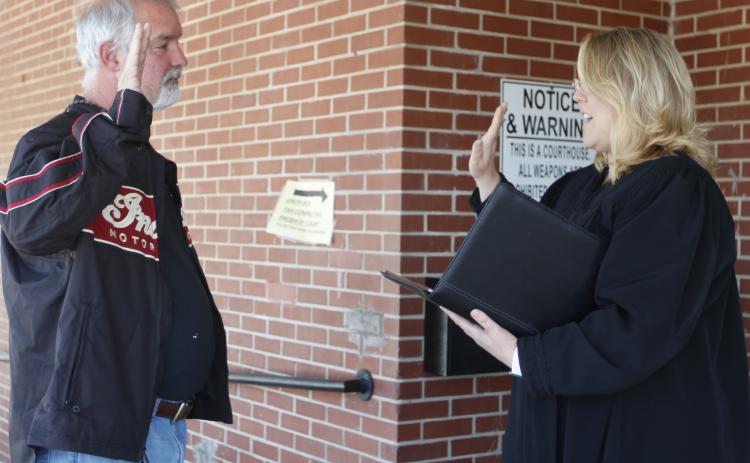 Elbert County Probate Court Judge Stephanie Hewell (right) swore in Bowman City Councilman Christopher Johnson outside Hewell’s office last week. (Photo by Scoggins)