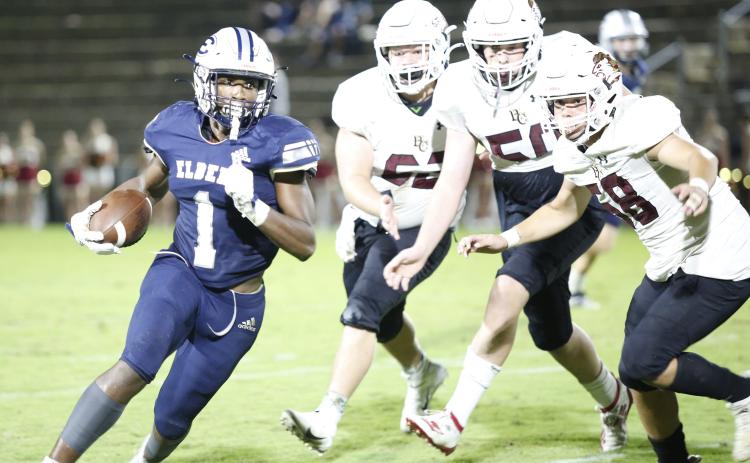 Elbert County Blue Devil sophomore running back Quan Moss (No. 1)  searches for running room Friday night in the Historic Granite Bowl against Hebron Christian Academy. (Photo by Scoggins)