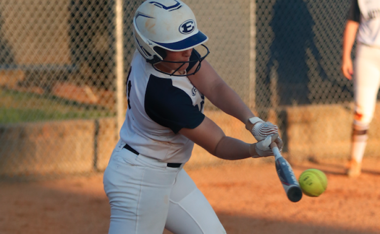 Making contact: Ellie Jourolmon rips a base hit in a contest earlier this year. The Lady Devils have a tune-up game against Social Circle Thursday prior to going into the playoffs Monday. (Photo by Scoggins)