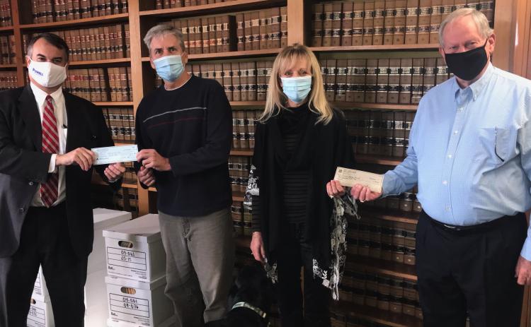 Georgia House District 33 Representative Rob Leverett (left) and Jerry Spivey (right) made a donation to Friends Helping Friends last week, using funds they would have normally spent for an annual buffet that was canceled due to COVID-19. Shown accepting donation are Jeff and Sandy Adams. (Photo by Jones)