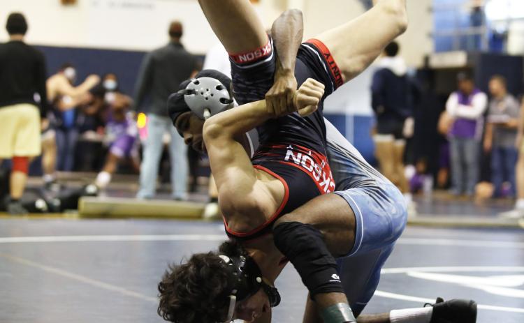 Senior Tyshawn Hughes secured his 100th career win Dec. 19 in the Oconee County Tommy Warren Duals. (File photo by Scoggins)