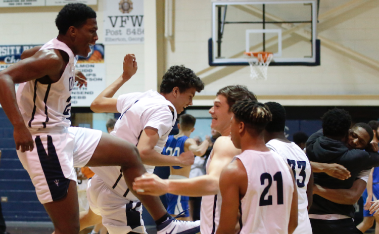 Sophomores Quon Moss (far left) and Kane Hughes and juniors Bryce Dickerson and Trustin Allen (21) jump for joy after the Devils’ 89-85 victory over Banks in double OT Jan. 22 in the Inferno while juniors Jamil Burton and A.J. Henderson celebrate with a hug. (Photo by Scoggins)
