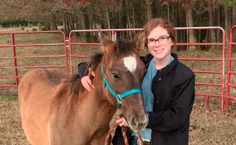 Emma Albertson and “Rutt” got together when Emma found out about the American Quarter Horse Youth Association’s Young Horse Development Program.