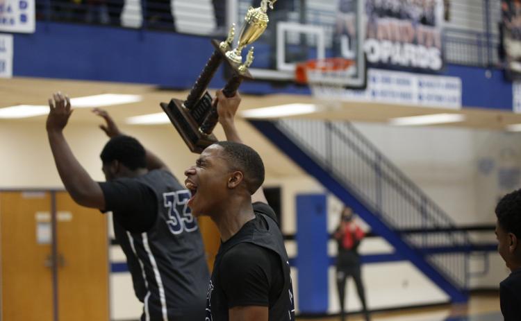 Blue Devil Jamil Burton celebrates the Devils’ Region Championship win at Banks County High School Thursday, Feb. 18. (Photo by Scoggins)