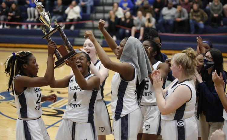 Lady Devils Jamia and Jameria Allen, Lilly Ray and Brenasia Faust celebrate the Lady Devils' Region Championship win at Banks County High School Thursday, Feb. 18. (Photo by Scoggins)