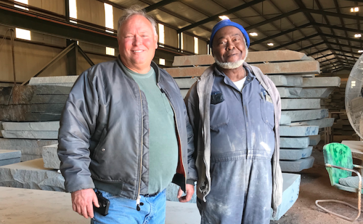 Mark Hill stands with Hillcrest Granite’s first employee, Clark Rucker, who was hired by the fledgling granite company back in 1979, when Mark and his father, Calvin, started the business. (Photo by Jones)