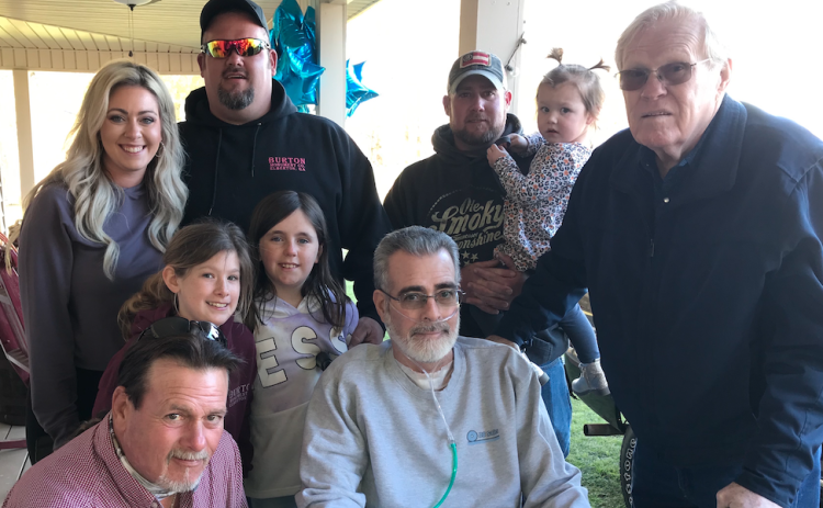 After more than a month in an Athens hospital with COVID-19, including time spent on a ventilator, Rick Burton came home to a celebration set up by his family and friends. Shown are (front, L-R) his brother Johnny Burton, Rick and his father, Garland; behind Johnny and Rick (L-R) are Isabella and Blakely; and in the back are Bailee, Blake, Brad and Ruby Grace. (Photo by Jones)