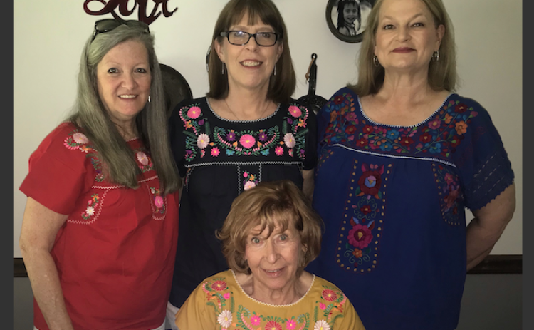 World travelers visiting in Elberton (standing, L-R) two weekends ago included hostess Twyla Lovinggood, Sharon Taylor, Camille Kateb and Diane Hughes (seated with Shenna Shepard on Zoom). (Photo by Jones)
