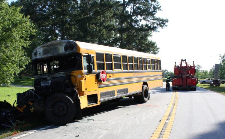 Charred remains of an Elbert County school bus were towed away after last Wednesday’s traffic fatality on Georgia Highway 368 (Anderson Highway).