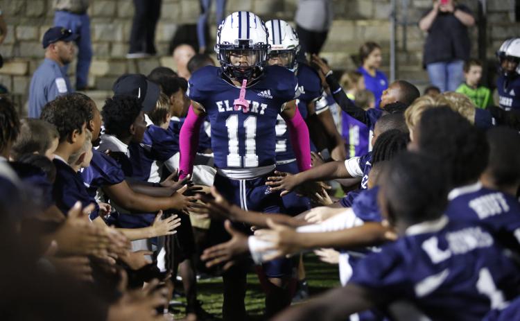Blue Devil Christian Harris walks through a tunnel of future Blue Devils and current football players from Elbert County Parks and Recreation before the Oct. 15 game against Union County in the Granite Bowl. (Photo by Scoggins)