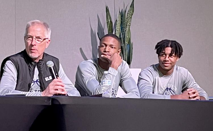 Elbert County boys basketball coach Don Hurlburt listens to a question along with players (from left) Jamil Burton and Trustin Allen. (Photo by Matthew Osborne, CNI News Service)