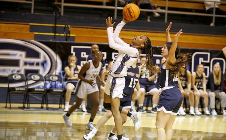 Junior Niya Moon goes for a layup during Thursday’s scrimmage against West Oak in the Inferno. The Lady Devils, along with head coach Josh Jones, are looking to bring home a state championship this season. (Photo by Scoggins)