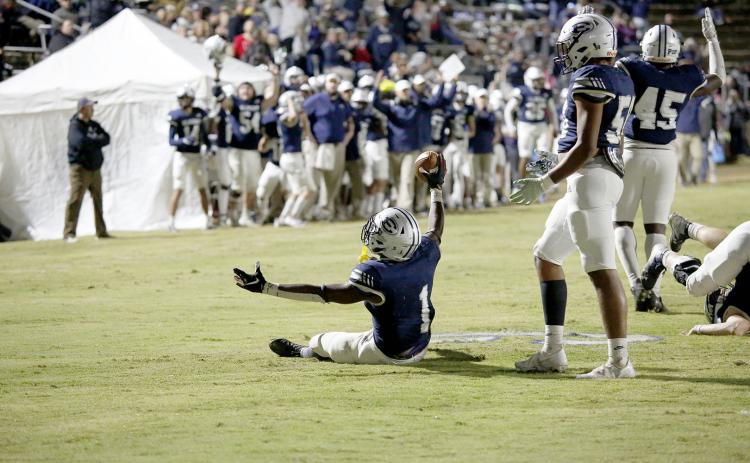 Quan Moss reacts to scoring a touchdown for the Blue Devils during the team's 26-14 loss in the first round of the GHSA state playoffs in the Granite Bowl Friday, Nov. 12.. (Photo by Scoggins)