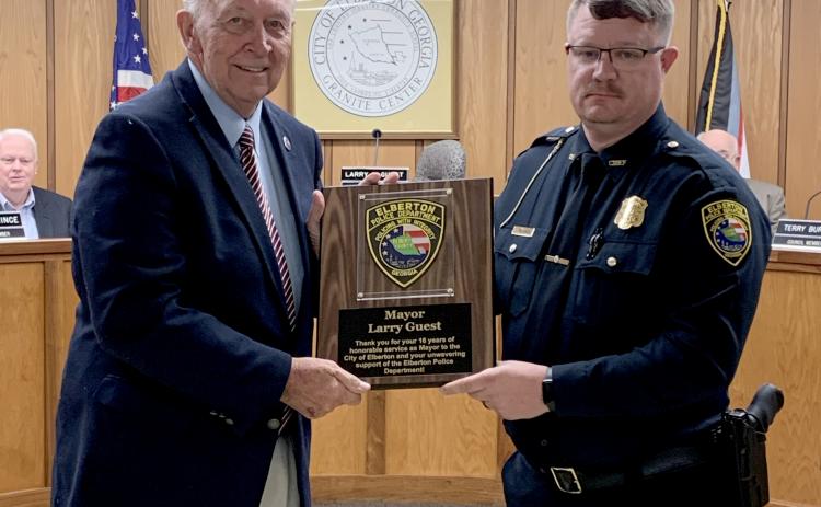 Elberton Police Chief Scott Marunich  (right) recognized Mayor Larry Guest (left) for his 16 years of service as mayor of Elberton during Monday night’s meeting. Guest’s last meeting as mayor will be the Jan. 3 meeting. (Photo by Scoggins)