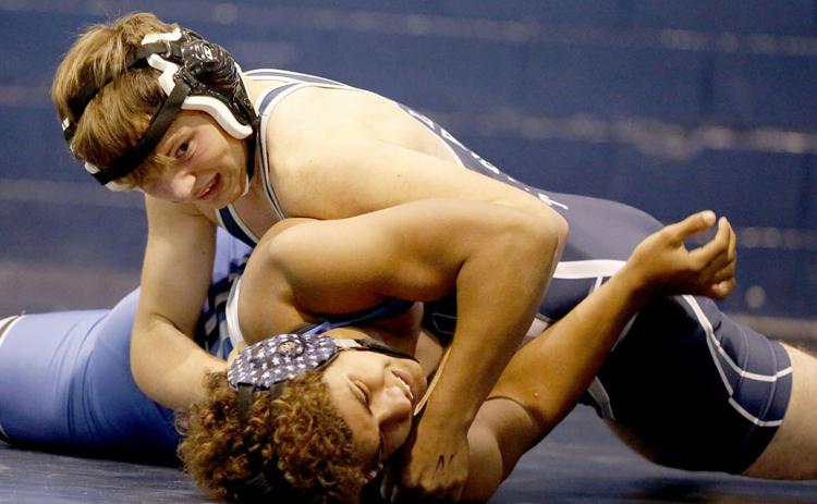 Josiah Harkins makes a half nelson pin during the JV Inferno at the Inferno Tuesday, Nov. 23. Harkins finished in second place for the day at 152 pounds. (Photo by Scoggins)
