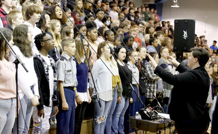 The Elbert County Chorus program, led by Director Allyson Dye and pictured above during the annual Veterans Day program at ECCHS, is raising funds to perform at the Pearl Harbor commemoration in Hawaii next year. (Photo by Scoggins)