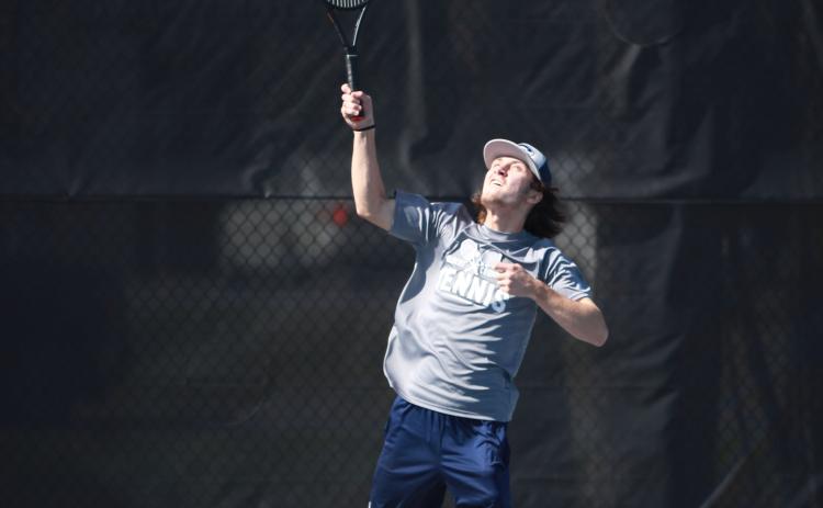 The Devils tennis team, including Alex Bennett (right) finished fourth in the region. Both teams were scheduled to advance to the first round of the GHSA state playoffs Tuesday. (File photos by Scoggins)