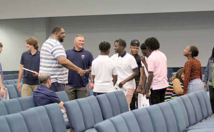 Coach Ed Geth (left) was introduced to members of the Devils basketball team Monday, April 25 during the team’s end-of-the-year banquet. Although not officially hired, the committee to hire a new Devils head basketball coach will recommend the BOE hire Geth at the May 9 work session. (Photo by Wells)