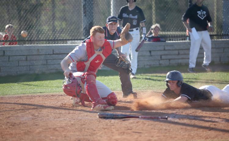 Landon Heaton slides into home during the Diamond Devils’ doubleheader against Rabun County Friday, April 1. The Diamond Devils will host Oglethorpe County Thursday. (Photo by Wells)