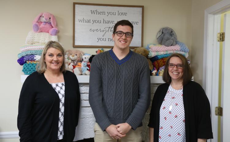 Harmony House’s (L-R) Client Services Advocate Jennifer Rainer, Mental Health Counselor Darrin Haley and Outreach/Volunteer Coordinator Wendy Risner are working to bring community awareness to what Harmony House does during National Child Abuse and Sexual Assault Awareness Month. (Photo by Scoggins)