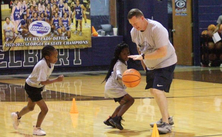 Lady Devils Head Coach Josh Jones practices skills with Lady Devil Youth Campers (L-R) Skylar Henderson and Kassydi Mattox during the state champions’ camp at the end of June in the Inferno. (Photos by Wells)