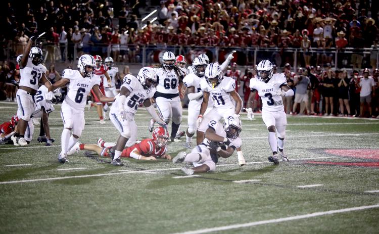 A host of Blue Devils celebrate as Gilbert Fortson (No. 42) recovers a fumbled ball from Madison County’s Red Raiders during the Devils’ 48-34 win over the county-line rivals Friday, Aug. 26 in Danielsville. After Friday’s game, the Devils top the state charts at No. 11 for Class A Division 1, according to MaxPreps. The Devils return home Friday, Sept. 2 to host Harlem for their third game of the season. (Photo by Scoggins)